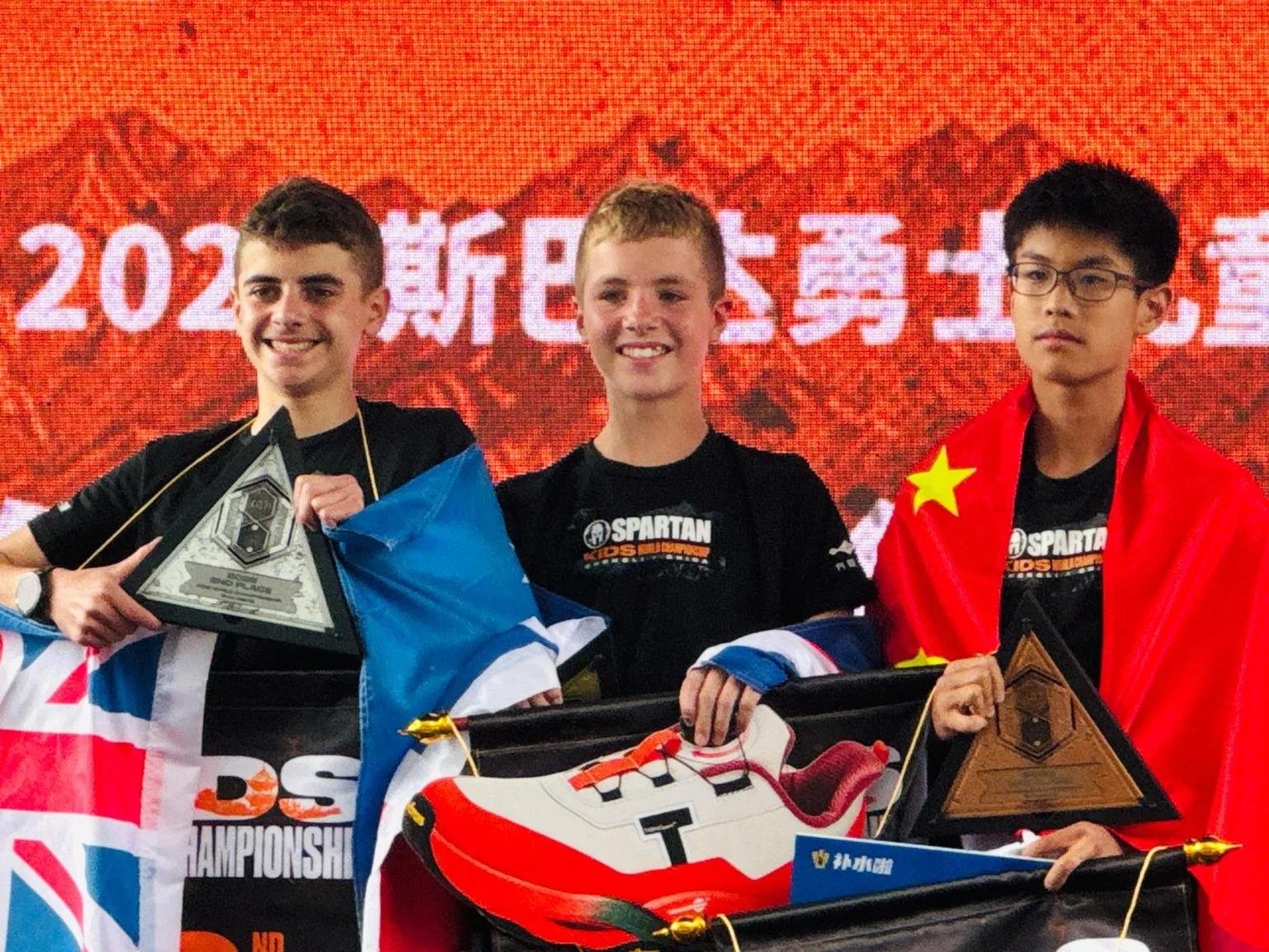 Harry Jeffery on the Spartan Kids World Championship podium in Chongli